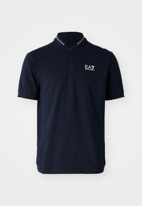 Navy polo shirt with a close-knit collar, three buttons, and metallic stud accents. Features an embroidered EA7 logo on the left chest.