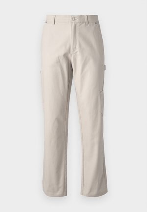 Beige cargo pants made of sturdy cotton with straight legs, front button closure, and side pockets for utility. Smooth texture with subtle stitching.