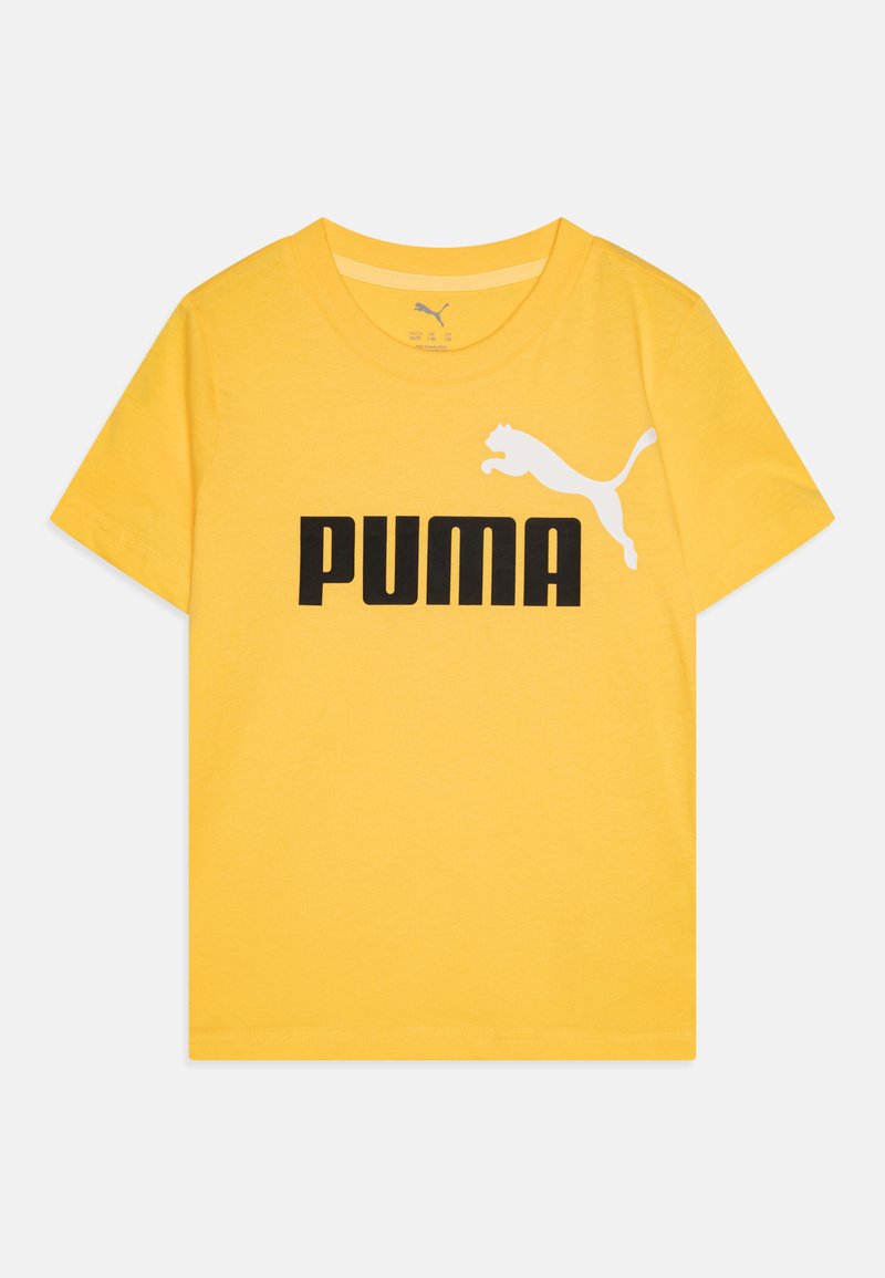 Dzeltena kokvilnas T-kreklā ar melnu "PUMA" logotipu un baltu diagonālu kaķa siluetu. Īsas piedurknes, apaļa kakla izgriezums, gluda tekstūra un taisna jostasvieta.