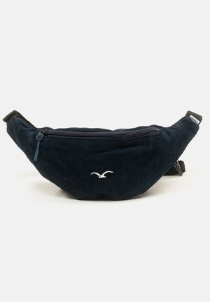 Navy corduroy fanny pack with a front zip pocket, featuring a white bird logo and black adjustable strap. Rounded shape with textured fabric.