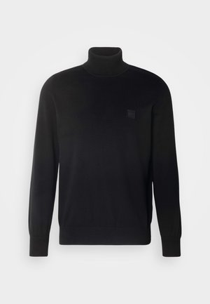 Zwarte coltrui met lange mouwen, geribbelde kraag en manchetten, gemaakt van een gladde stof. Bevat een klein logo-embleem op de borst.