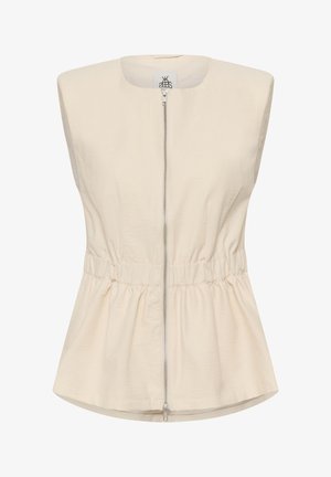 Brezrokavnik v bež barvi z zadrgo spredaj, nabranim elastičnim pasom in okroglim izrezom, izdelan iz lahkega blaga.