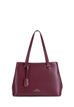 Dunkelrote Lederhandtasche mit zwei Schulterriemen und kleinem goldenen Wittchen-Logo vorne mittig.