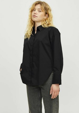 Black long-sleeve collared shirt with a loose fit, featuring a straight hem and button front, made from a smooth, lightweight fabric.
