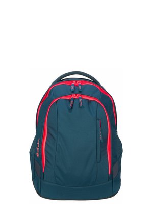 Dark teal backpack with bright red zippers, multiple compartments, a top handle, and padded sides for support.