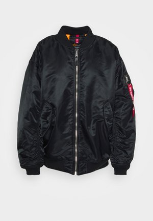 Black bomber jacket made of smooth, shiny material. Features a zip front, ribbed cuffs, side pockets, and a zippered arm pocket with a red tag.