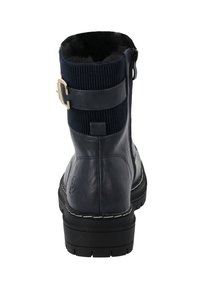 Stivale alla caviglia in pelle blu navy con tomaia in tessuto a coste, cerniera laterale e fascia decorativa con fibbia. Suola testurizzata per una maggiore aderenza.
