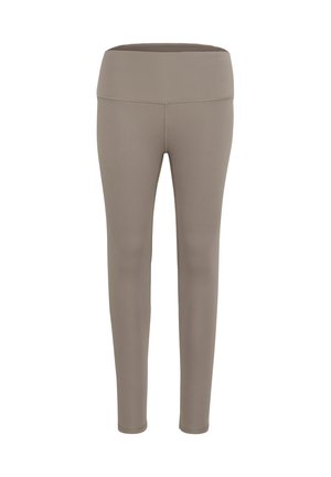 Leggings beige realizzati in tessuto elasticizzato, con una vita ampia e piatta e una superficie liscia, progettati per il comfort e la facilità di movimento.