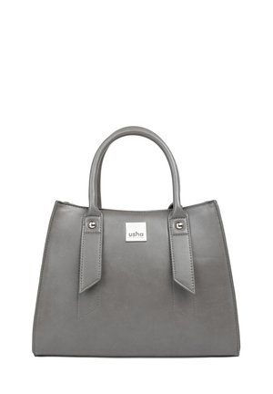 Sac à main en cuir gris avec deux anses et une étiquette rectangulaire argentée portant la mention « usha » au centre devant.