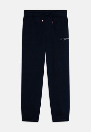 Pantalones de chándal en color azul marino con puños elásticos, cintura con cordón y detalles del logo en blanco en el muslo. Tejido suave de mezcla de algodón con una textura lisa.