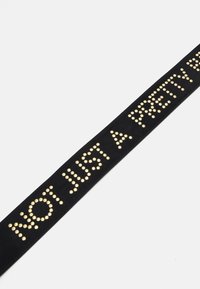 Moschino thick logo belt in Fantasia Black Moschino Logo Belt | Black | FARFETCH main image 4