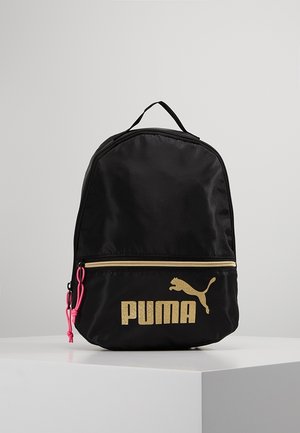 Black Puma backpack with gold logo, front zip pocket with gold zipper, and pink zipper pulls, standing on a white surface.