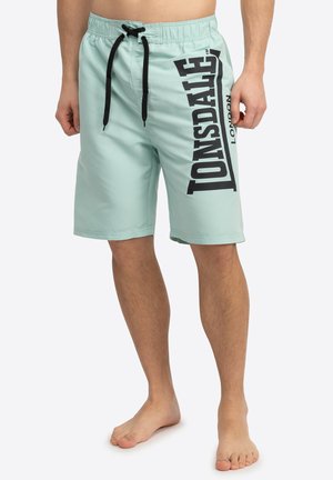 Costume da bagno azzurro chiaro realizzato in tessuto asciugatura rapida, con il logo nero "Lonsdale" sul lato e una vita elastica con cordoncino.