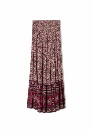 Jupe maxi florale en tissu léger avec taille froncée, présentant un fond crème et des motifs floraux rouges et roses avec des accents de bordure.