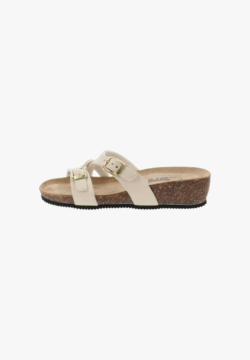 Sandales compensées beiges dotées de deux boucles réglables, d'une semelle en liège et d'une semelle extérieure en caoutchouc texturé. Des brides croisées pour un soutien et un confort optimaux.