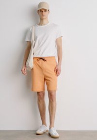 HUGO Treniņtērpa apakšdaļas - medium orange