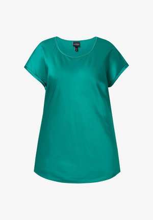 Turkoois korte mouwen blouse met een ronde halslijn, een gladde textuur en een langere achterkant. Heeft subtiele stiksels rond de hals.