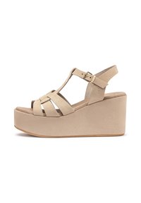 Sandali platform in suede beige con design a T e molteplici cinghie incrociate. Presentano una fibbia alla caviglia e un tacco a zeppa texturizzato.