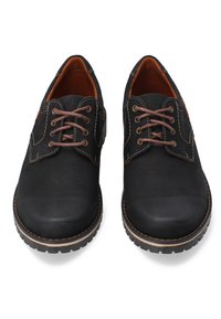 Zwarte leren schoenen met bruine veters, met een ronde neus, gestikte details en een gestructureerde rubberen zool. Het interieur is bruin gevoerd.