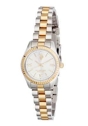 Montre-bracelet en métal bicolore argent et or avec cadran blanc, chiffres romains dorés aux positions 3, 6, 9 et logo à 12 heures.