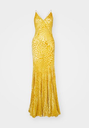 Robe jaune à imprimé léopard, sans manches, avec un décolleté en V, un corsage ajusté et une jupe fluide, fabriquée dans un tissu brillant et texturé.