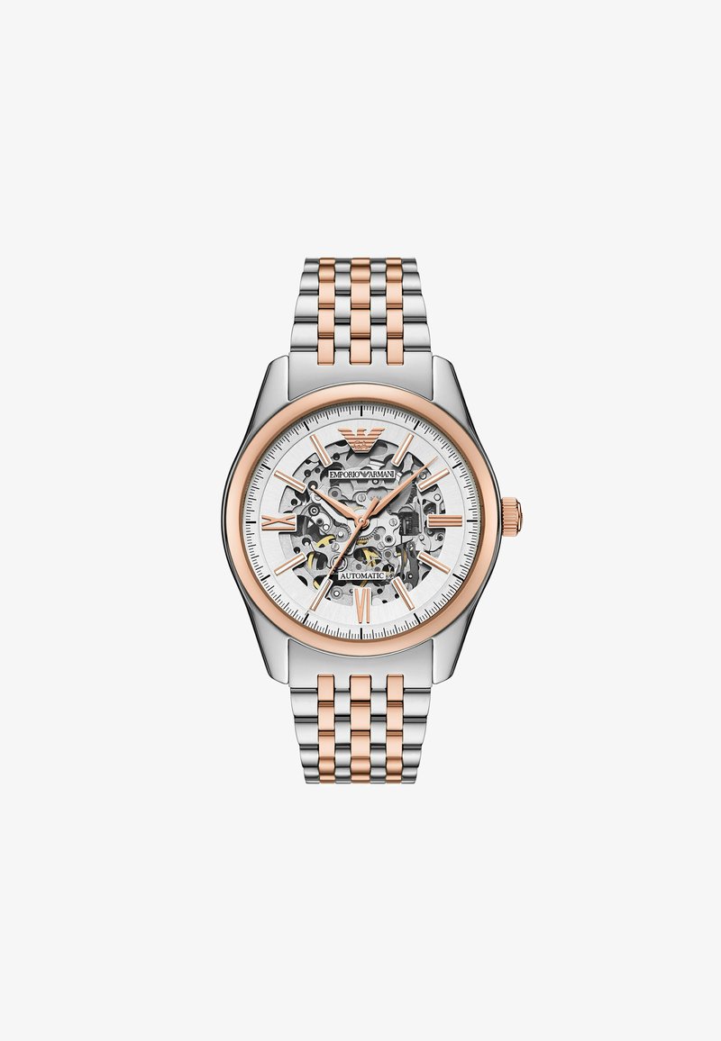Automatisch horloge met een zilveren en roségouden roestvrijstalen band. Kenmerkt zich door een skeletdial, witte wijzerplaat en gouden accenten op de uurmarkeringen.