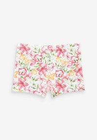 Shorts a stampa floreale con fiori rosa, gialli e verdi su sfondo bianco; tessuto morbido, design aderente e senza hardware visibile.