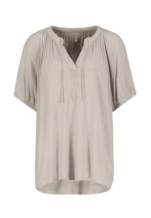Light beige short-sleeve blouse with a V-neck, gathered detailing around the neckline, and a relaxed fit. Smooth texture with a flowing design.