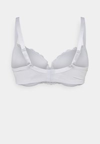 White bra with smooth fabric, adjustable straps, lace trim along the edges, and a hook-and-eye closure at the back.