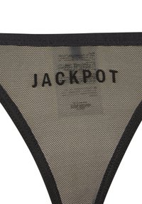 String en mesh noir avec l'inscription "JACKPOT" en texte noir gras. Le matériau est léger et transparent, avec une texture lisse et des bords contrastants.