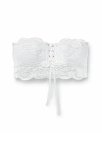 Vit spets strapless bralette med blommönster, en vågig kant, en design med snörning framtill, och en knytbanddetalj i mitten.