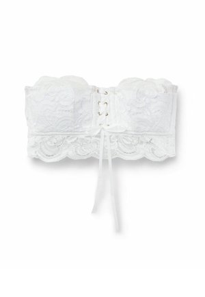 Bralette sans bretelles en dentelle blanche avec des motifs floraux, un bord festonné, un design avec un laçage à l'avant et un détail de ruban noué au centre.