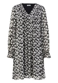 Robe noire et blanche à manches longues avec motif abstrait en points, encolure en V et poignets volantés aux manches.