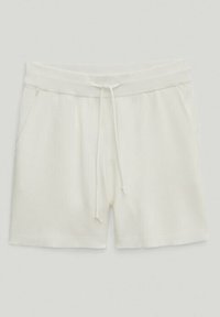 Shorts blancs en coton avec cordon de serrage, poches latérales et taille élastique, posés à plat sur un fond clair.