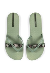 Green flip-flops with textured soles. Features camouflage-patterned straps and a central logo design. Made from flexible, durable material.