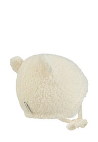 Cream-colored fleece hat with soft texture, rounded shape, and small ear accents. Features braided tie straps and a small label on the side.