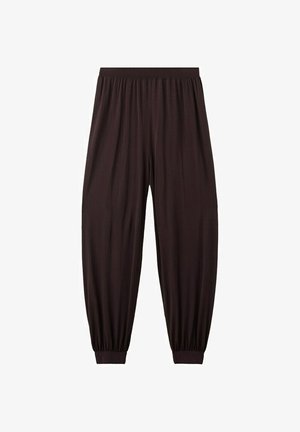 Tmavohnedé nohavice s voľným strihom, elastickým pásom a manžetami, vyrobené z ľahkej, vzdušnej látky.
