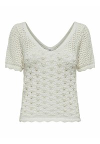 Top de punto blanco con mangas cortas, escote en forma de V y dobladillo con picos. El intrincado diseño de calado presenta un patrón texturizado en todo su recorrido.