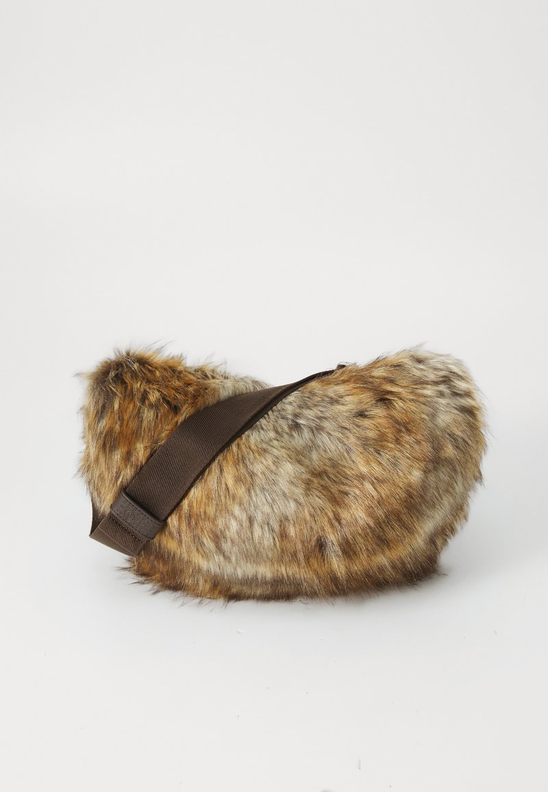 Faux fur brown and beige crossbody bag with a wide dark brown adjustable strap against a plain white background.