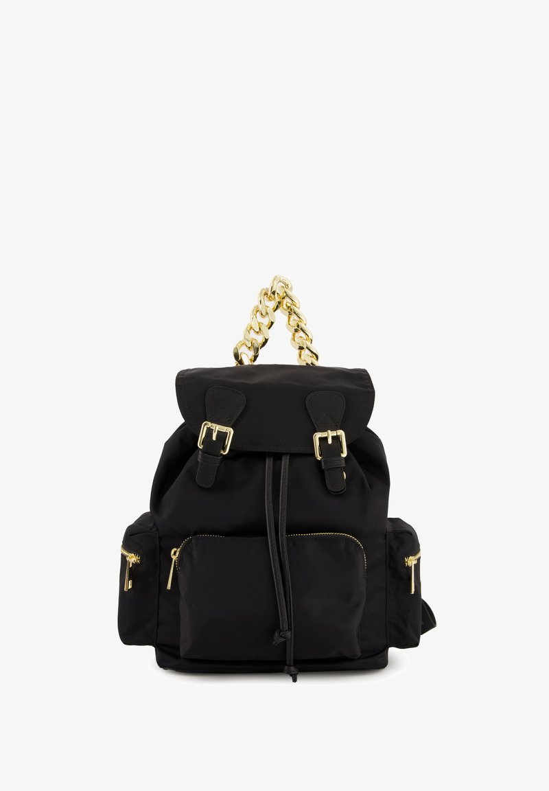 Black nylon backpack featuring a fold-over top, gold chain handle, and front zip pockets with gold zippers and leather accents.