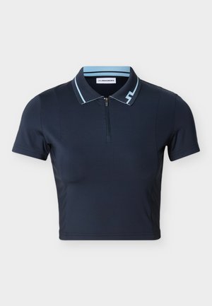 Marineblå kortermet poloshirt laget av glatt stoff. Har en glidelåsskjede med kontrasterende lyseblå detaljer og en slank, tettsittende design.