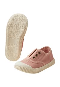 Pink canvas slip-on shoes with elastic side panels, white rubber toe cap, and textured outsole. Features bronze eyelets for breathability.