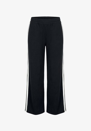 Schwarze weit geschnittene Hose mit weißen Seitenstreifen und elastischem Bund, gefertigt aus weichem Stoff.