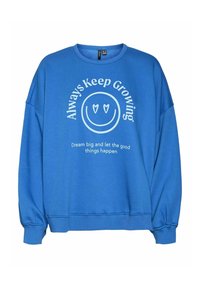 Sudadera azul de corte holgado, con cuello redondo y puños de canalé. En la parte frontal presenta texto blanco y un gráfico de una cara sonriente con corazones en los ojos.