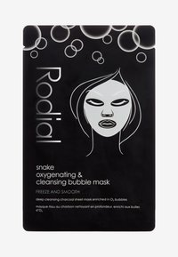 Black charcoal sheet mask packaging features a minimalist white face design with bubbles, labeled "Rodial" and "snake oxygenating & cleansing."