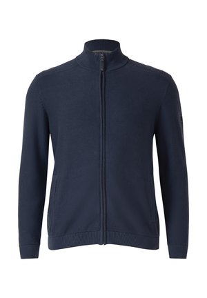 Marineblauwe cardigan met rits, gemaakt van glad gebreid materiaal. Voorzien van een hoge kraag, geribbelde manchetten en zijzakken. Eenvoudig ontwerp zonder patronen.