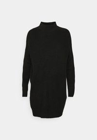 Pull noir en maille avec un col montant, des manches longues et une coupe décontractée. La texture est côtelée, avec un ourlet arrière légèrement plus long.