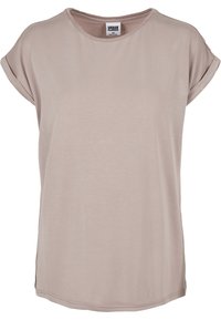 T-shirt beige chiaro realizzato in tessuto morbido, con collo rotondo, maniche corte arrotolate e spacchi laterali per maggiore comodità.