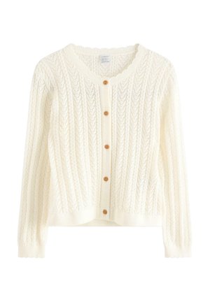 Strikcardigan i cremefarve med lange ærmer, bølgede kanter og fem brune knapper foran.