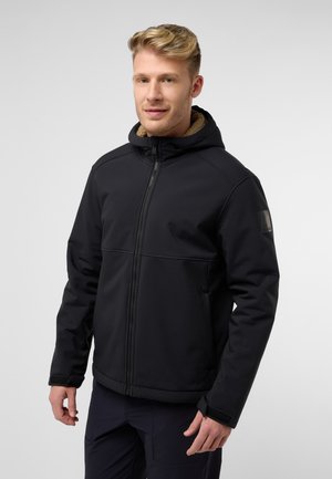Black jacket with a hood, made of soft material. Features a faux fur lining around the neck, zip closure, and a logo on the sleeve.